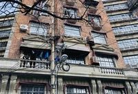 架空線整治引出三大煩惱，怎樣才能讓武康大樓無壓力拍張“素顏照”